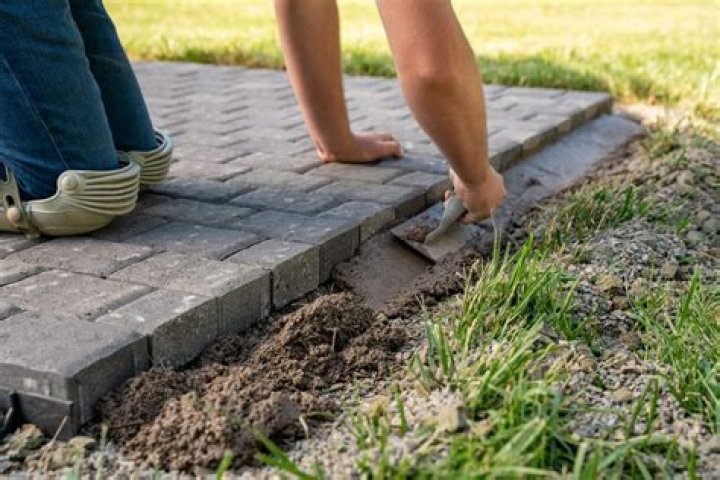 What do you put under paver edging?