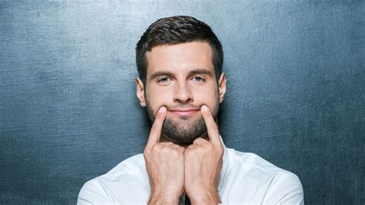 What is the word for faking a smile?